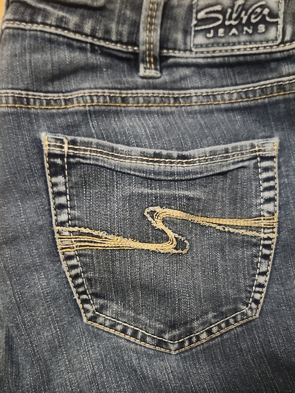Silver Jeans Women's Dark Blue Denim with Gold Pocket Stitching